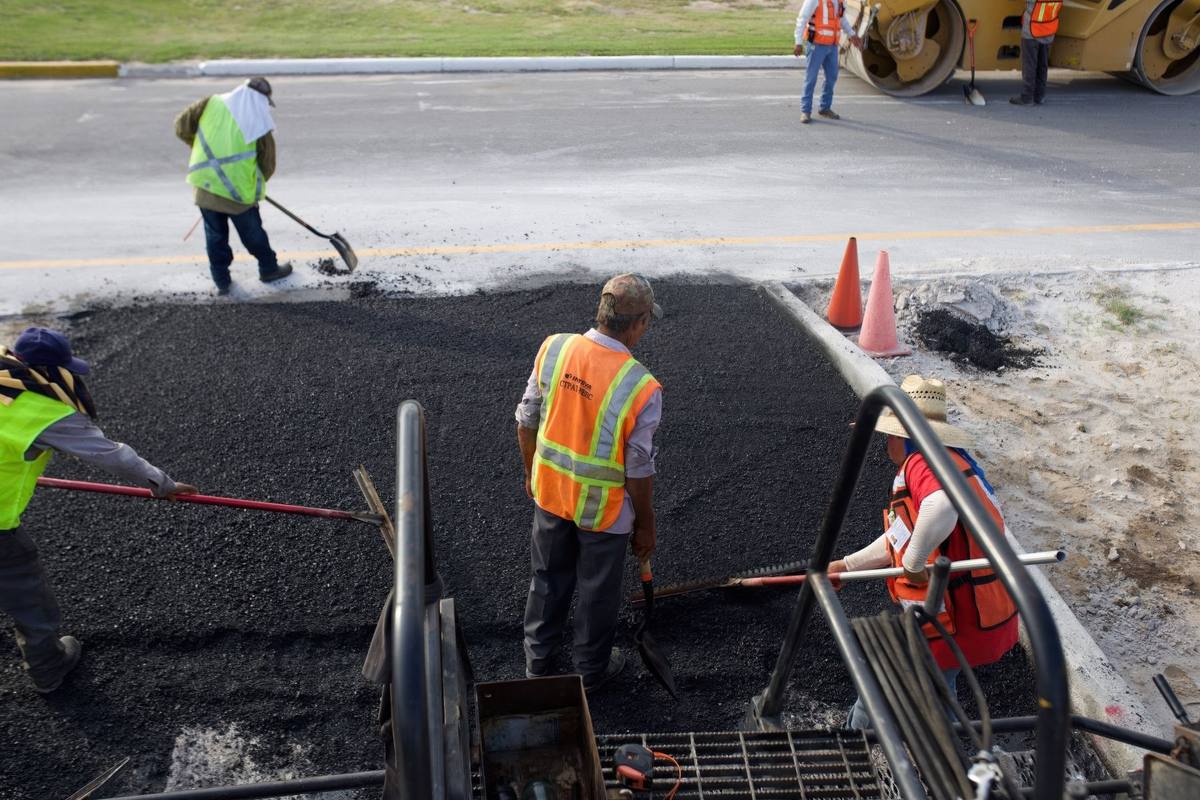 Asphalt professionals working on a paving project